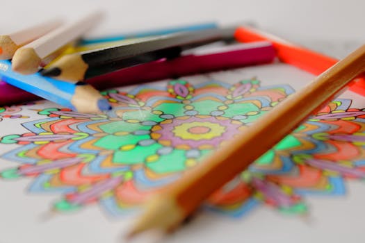 pexels-photo-5139532-5139532 Vibrant mandala coloring with colored pencils, showcasing creativity and art.